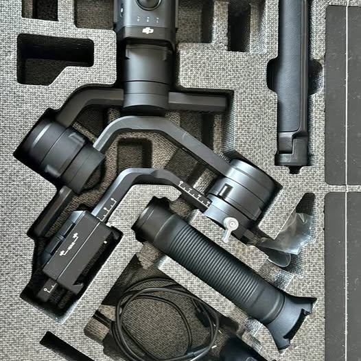 DJI Ronin-S gimbal stabilizer with handle, cables, and accessory mounts