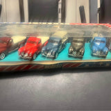 Diecast car set in display case with red, teal, gold, and blue cars