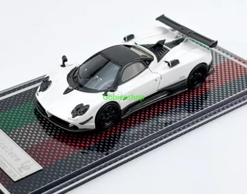 White racing sports diecast model car with black details on textured display base