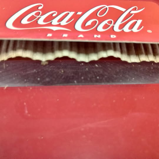Coca-Cola drink truck diecast close-up of red cab and white logo