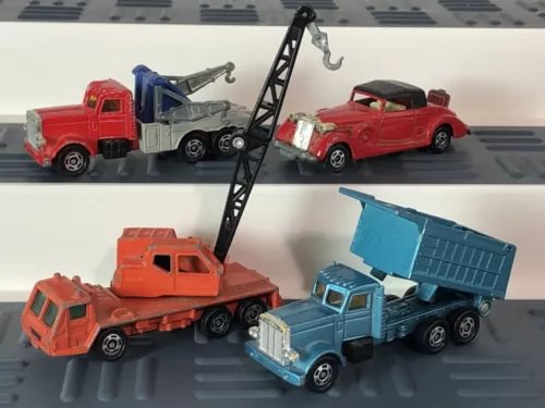 Diecast vehicle set with red coupe, dump truck, crane wrecker and blue truck