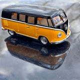 Yellow and black 1962 Volkswagen bus diecast model, 1:32 scale, front three-quarter view