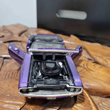 Purple diecast car model with open hood showing engine details