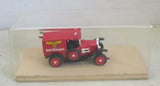 Diecast fire engine model, red vintage truck with front grille and ladder, in display case