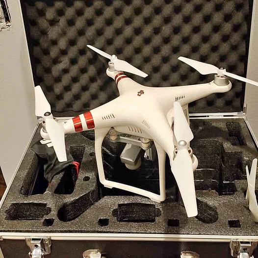 DJI Phantom Standard drone, white quadcopter with four propellers.