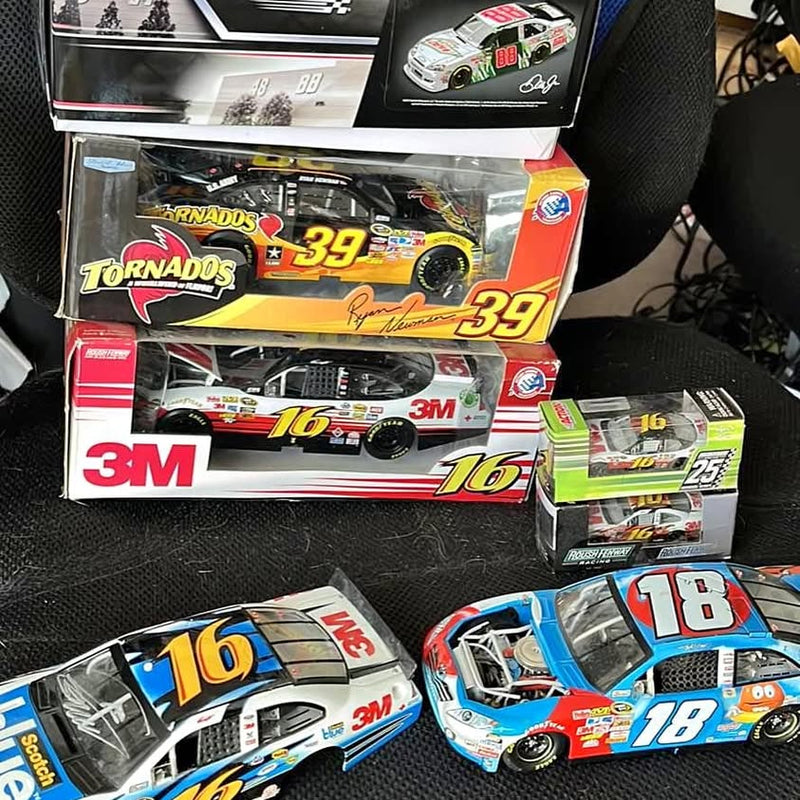 Diecast race cars #16 and #18 in retail boxes, with 3M branding and colorful decals