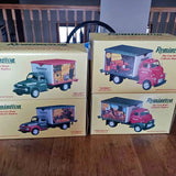 Remington metal diecast truck set in retail boxes with pink and teal trucks