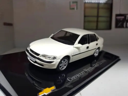 White diecast model car, front 3/4 view on black display base