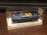 Blue classic diecast toy car in clear display case, 1:43 scale