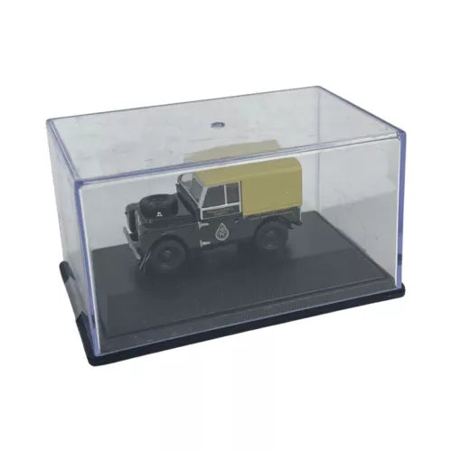 Diecast Land Rover model in clear display case, dark cab with yellow cargo cover