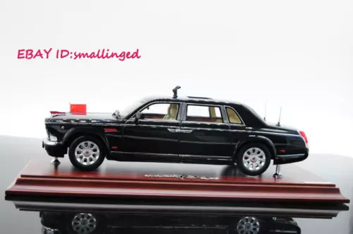 Black limousine diecast model car with red parade flag detail, 70th anniversary style