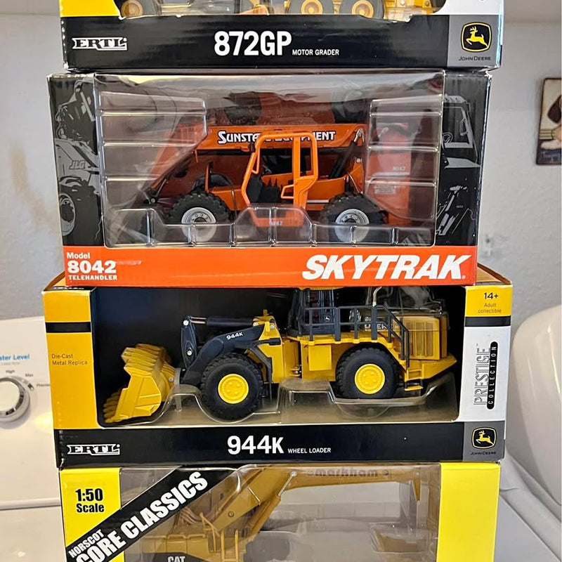 Ertl 1:50 diecast wheel loader toy, yellow with orange cab, boxed