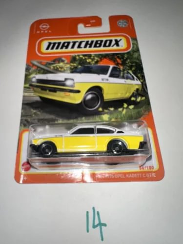 Matchbox 1/64 diecast car in yellow and white on blister card with Matchbox logo