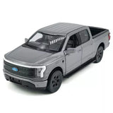 Gray 1:36 diecast toy pickup truck with open grille and headlights