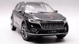 Black diecast SUV model car with front grille and headlights, red stripe accents