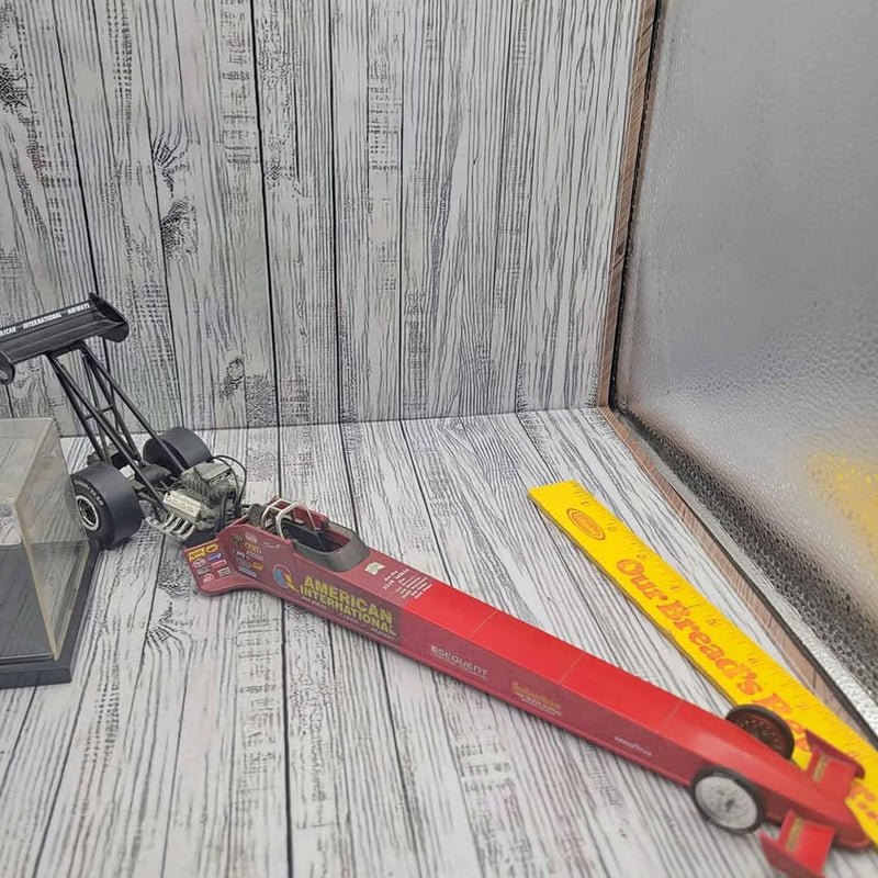 Die-cast dragster cars, red and yellow long race models