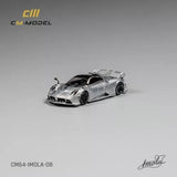 1:64 diecast model car, silver with black accents, front 3/4 angle