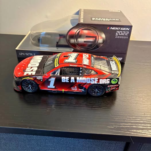 1:24 diecast race car with #1 orange and blue racing livery, sponsor decals