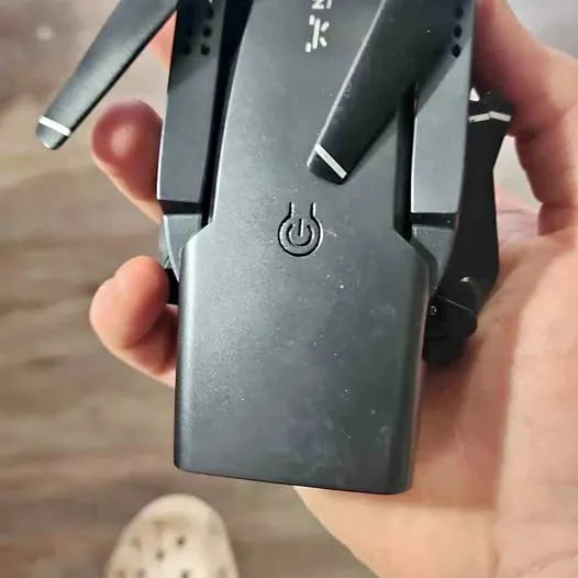 Gray drone body with power button icon