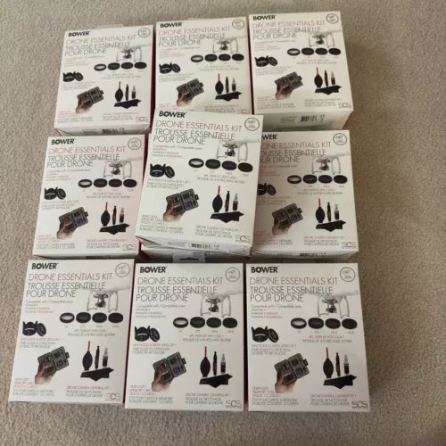 Drone essentials kit boxes with accessories and charging components, in retail packaging