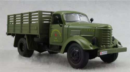 Green military truck diecast model with open cargo bed
