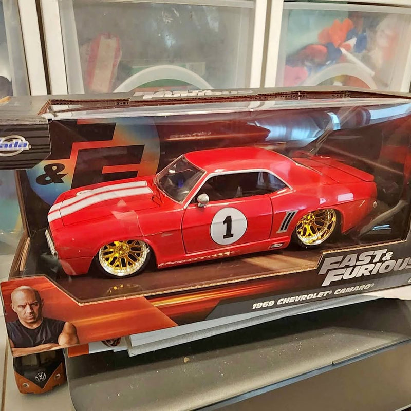 Die-cast 1969 Chevrolet Camaro red model car with black stripes, #1, in display box