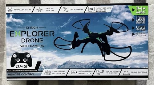 Remote-controlled quadcopter drone with camera on retail box