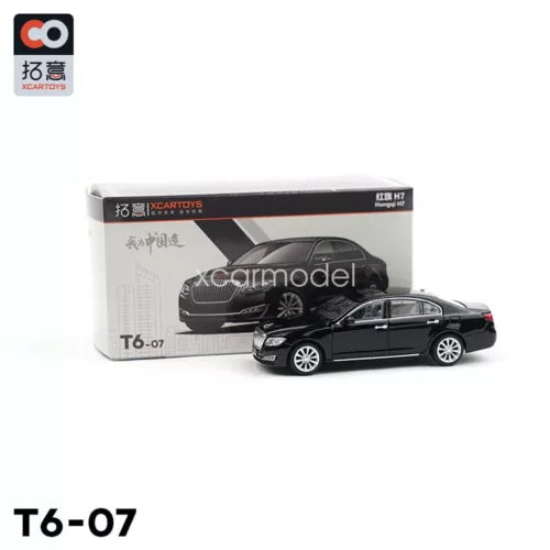 Black diecast sedan car model in box, front 3/4 view