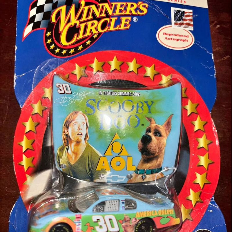 Scooby-Doo diecast car in clear blister package with blue backing and red stars
