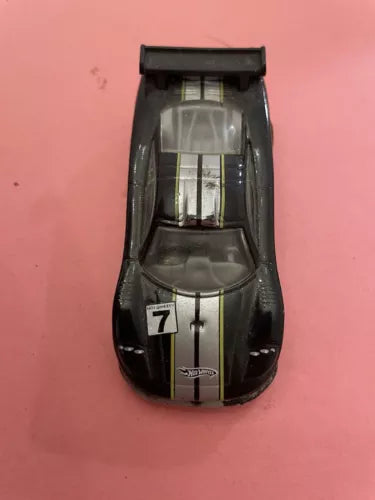 Black diecast car with windshield, front view, scale model