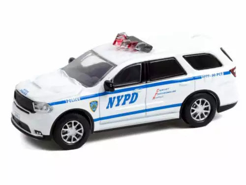 Diecast police SUV model truck in white with blue stripe and NYPD logo, front 3/4 view.