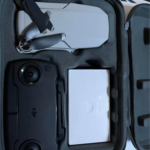Dji Mavic Mini drone with camera lens, inside protective case