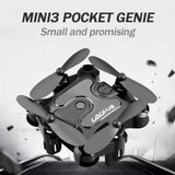 Mini foldable drone with four propellers, compact gray body and camera housing