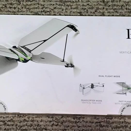 Mini parrot swing drone, white body with black landing legs and propellers
