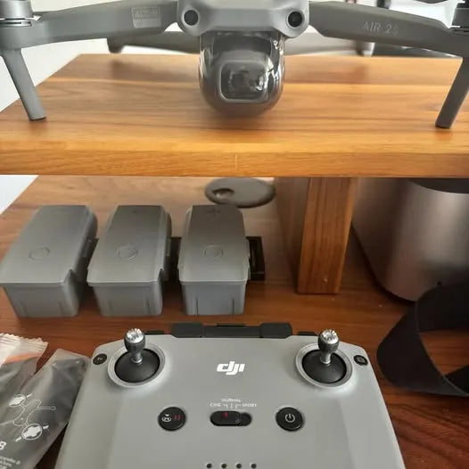 DJI Air 2S drone controller with dual joysticks and button panel