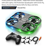 Mini quadcopter drone with green LED ring lights, plus black controller and accessories