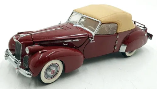 Red diecast convertible car with beige soft top, chrome front grille and bumper
