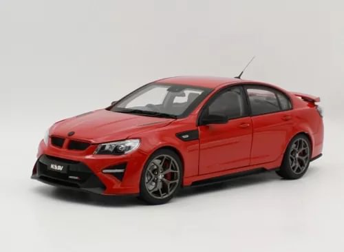 Red diecast model car with black hood and front grille, front three-quarter view, 1:18 scale