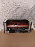 Brown 1979 Ford F-150 diecast pickup model in open box, American Legends branding
