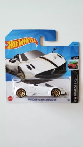 Diecast toy car in box, white and black Roadster model, 1:64 scale