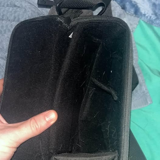 Black zippered drone carrying case with handle and fabric exterior