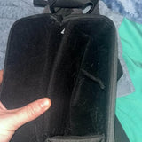 Black zippered drone carrying case with handle and fabric exterior