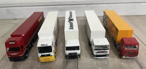 Set of five diecast trailer trucks in red, white, and yellow with trailers