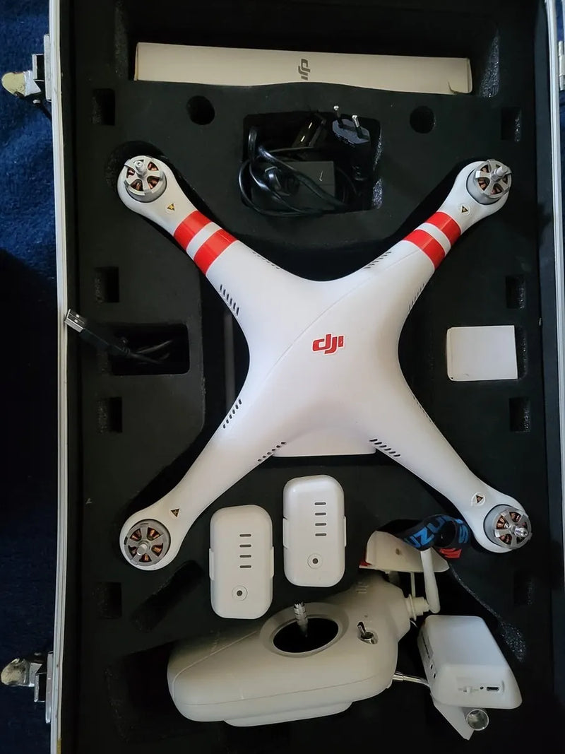 White DJI quadcopter drone with propellers and landing legs