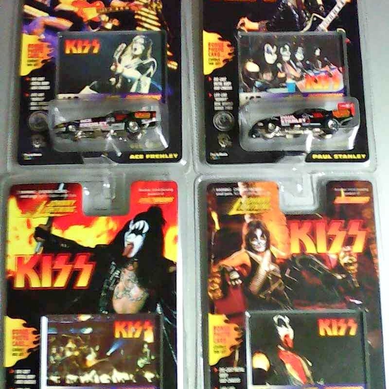 KISS diecast racing car in blister pack, silver car with flame decals, Johnny Lightning