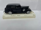 Black 1:43 scale diecast sedan model with base display stand