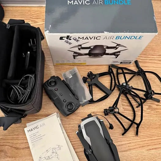 DJI Mavic drone kit with controller, drone, propeller guards, cables, and instruction manual
