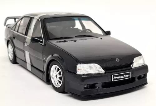 Metallic black diecast sedan model car with front grille and chrome wheels