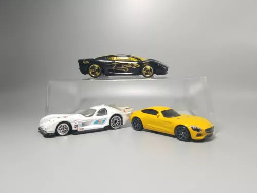 Hot Wheels diecast car set with yellow, white, and black race cars