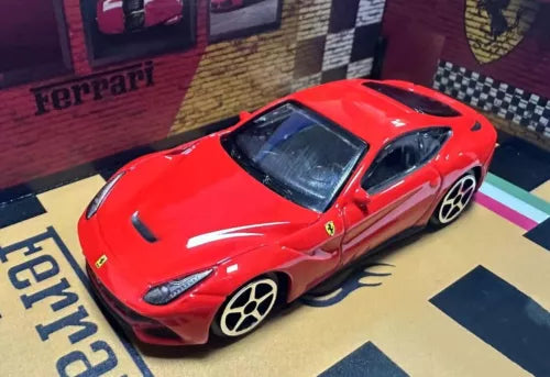 Red diecast Ferrari F12 Berlinetta model car toy, front 3/4 view.